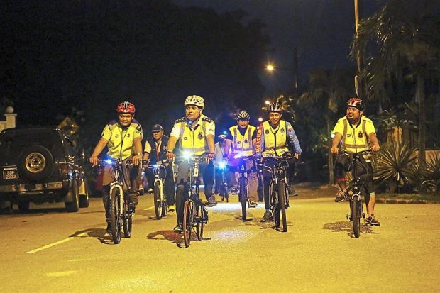 The police and the Gasing Indah Residents Association have cultivated a good relationship as they cycle together to patrol the neighbourhoood.