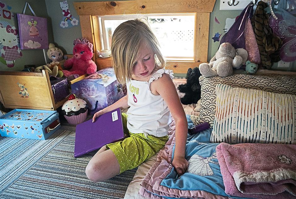 Story, six, playing in the loft. She and her sibling have three small plastic bins each for storing their entire wardrobe. Read more at http://www.star2.com/culture/design/2016/07/28/would-you-move-your-family-into-a-micro-house/#RweoSzg8JHICMI7A.99