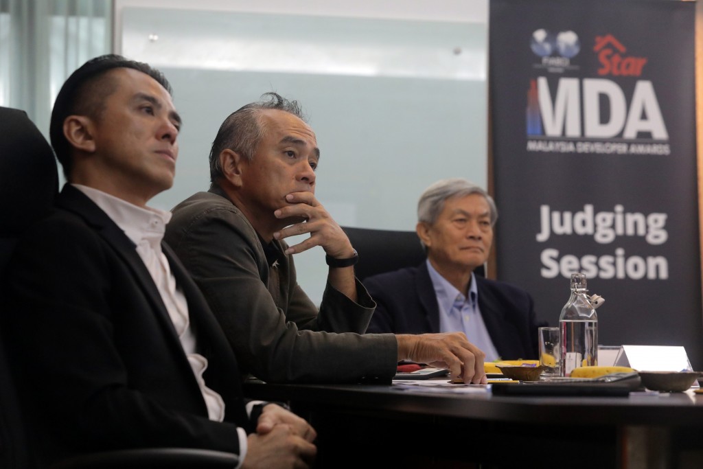 From left are Tan, Lim and Yeah who are listening attentively to the participating property developer for the international category which was conducted live from Melbourne.